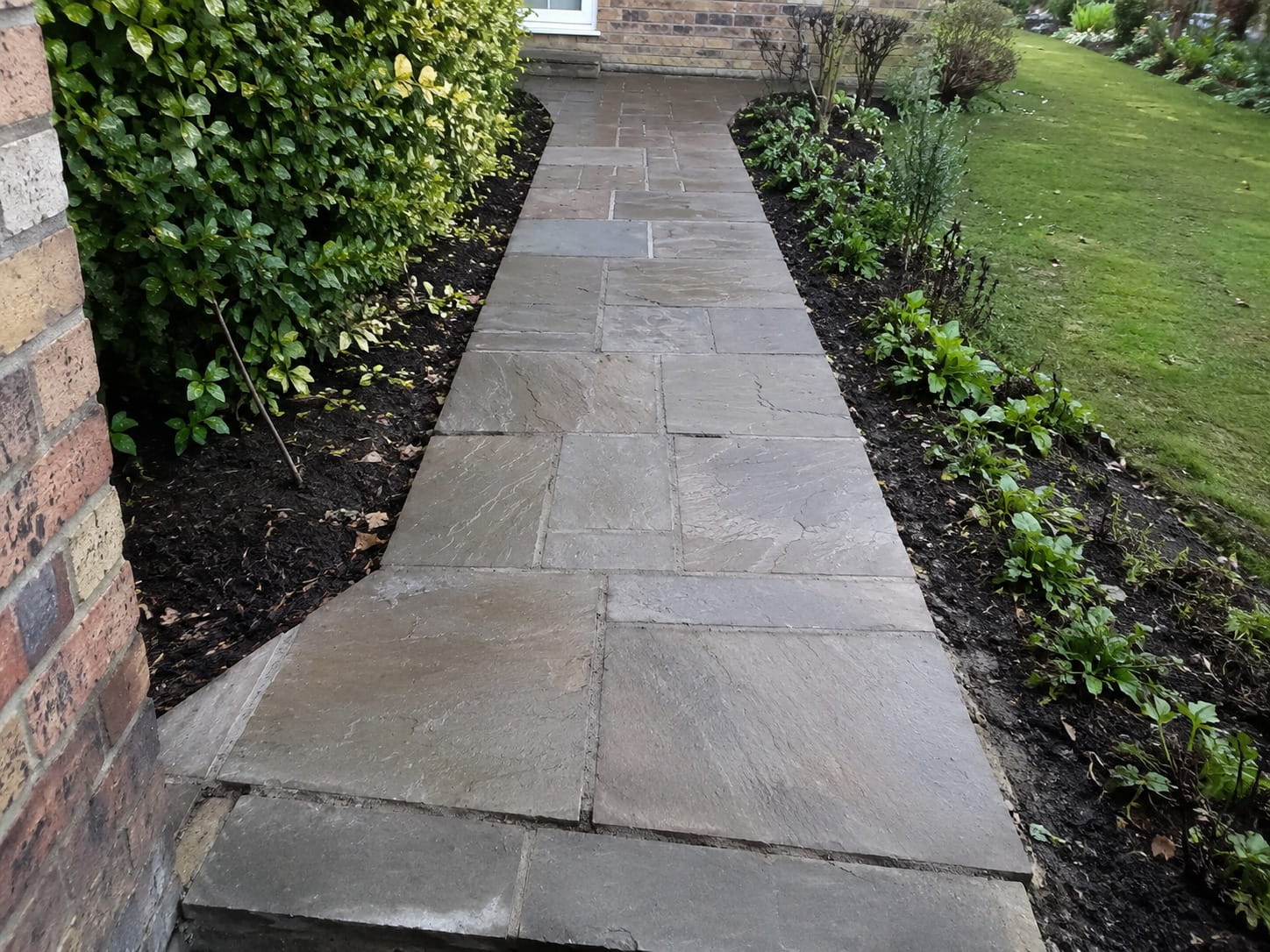 Stone paver garden path leading through a landscaped Perth front garden